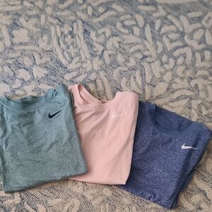 Nike Tees in Teal, Light Pink, and Heather Blue